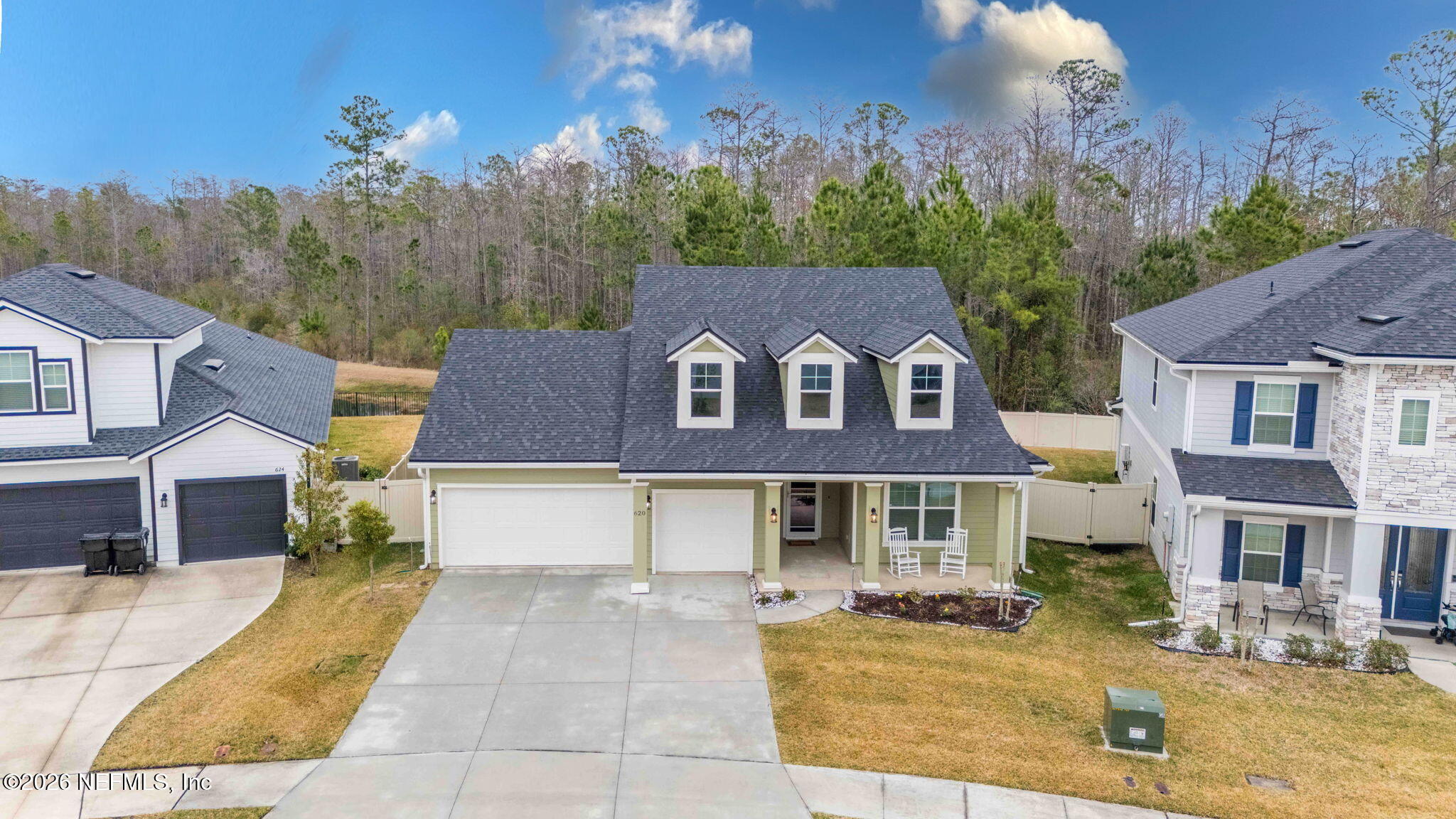 620 Ivory Palm Road Orange Park, FL 32073 - Photo 40 of 53 a front view of a residential apartment building with a yard