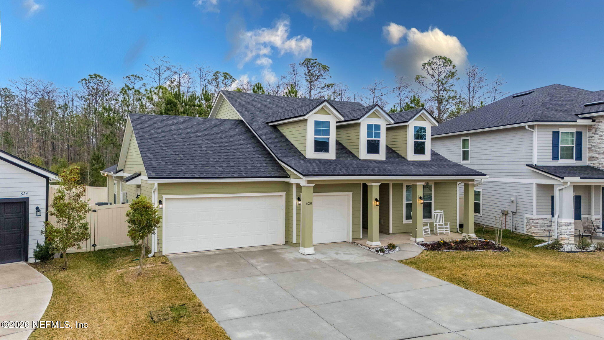 620 Ivory Palm Road Orange Park, FL 32073 - Photo 41 of 53 a front view of a house with a yard and a garage