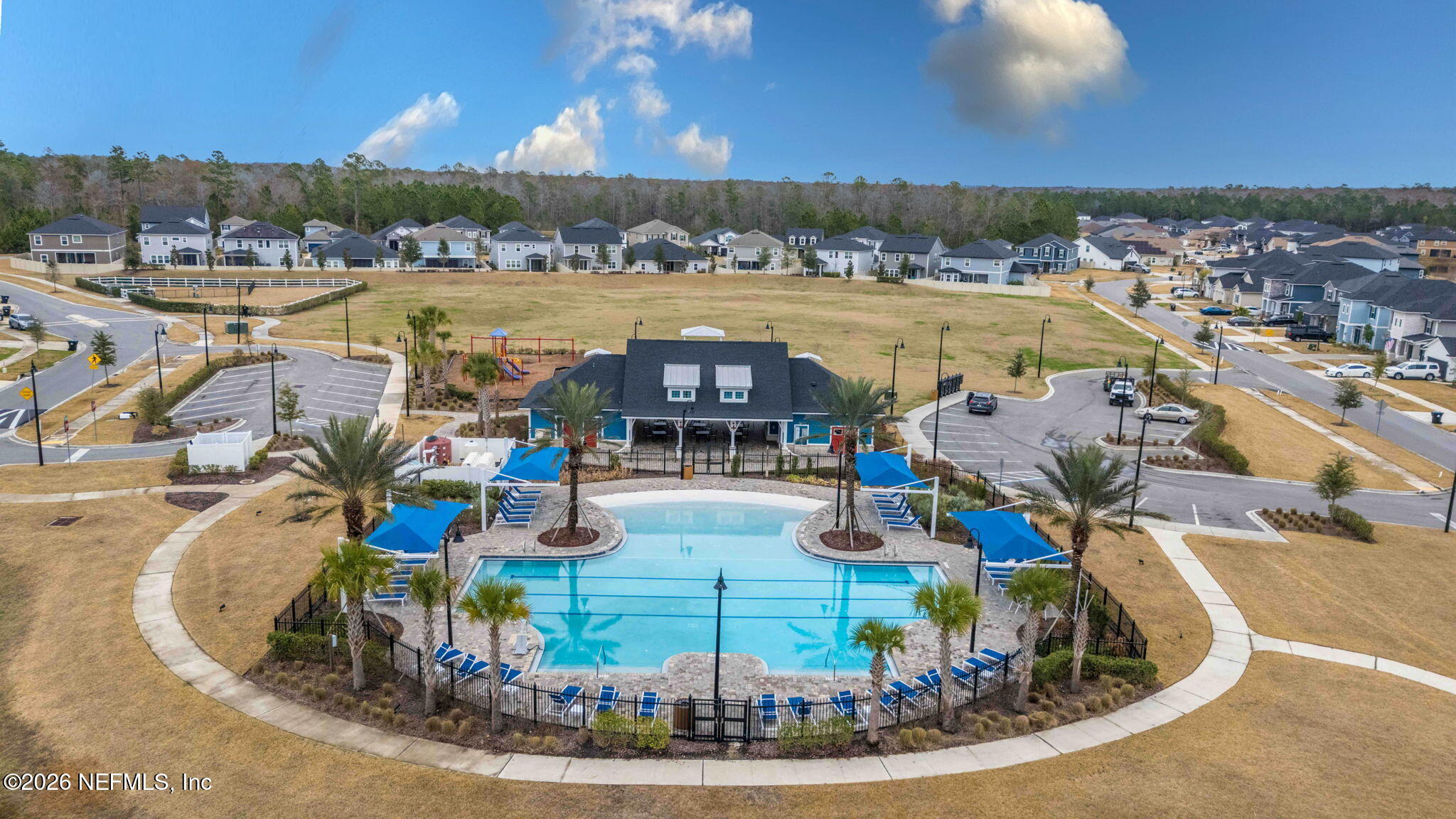 620 Ivory Palm Road Orange Park, FL 32073 - Photo 50 of 53 a view of a swimming pool with a table and chairs