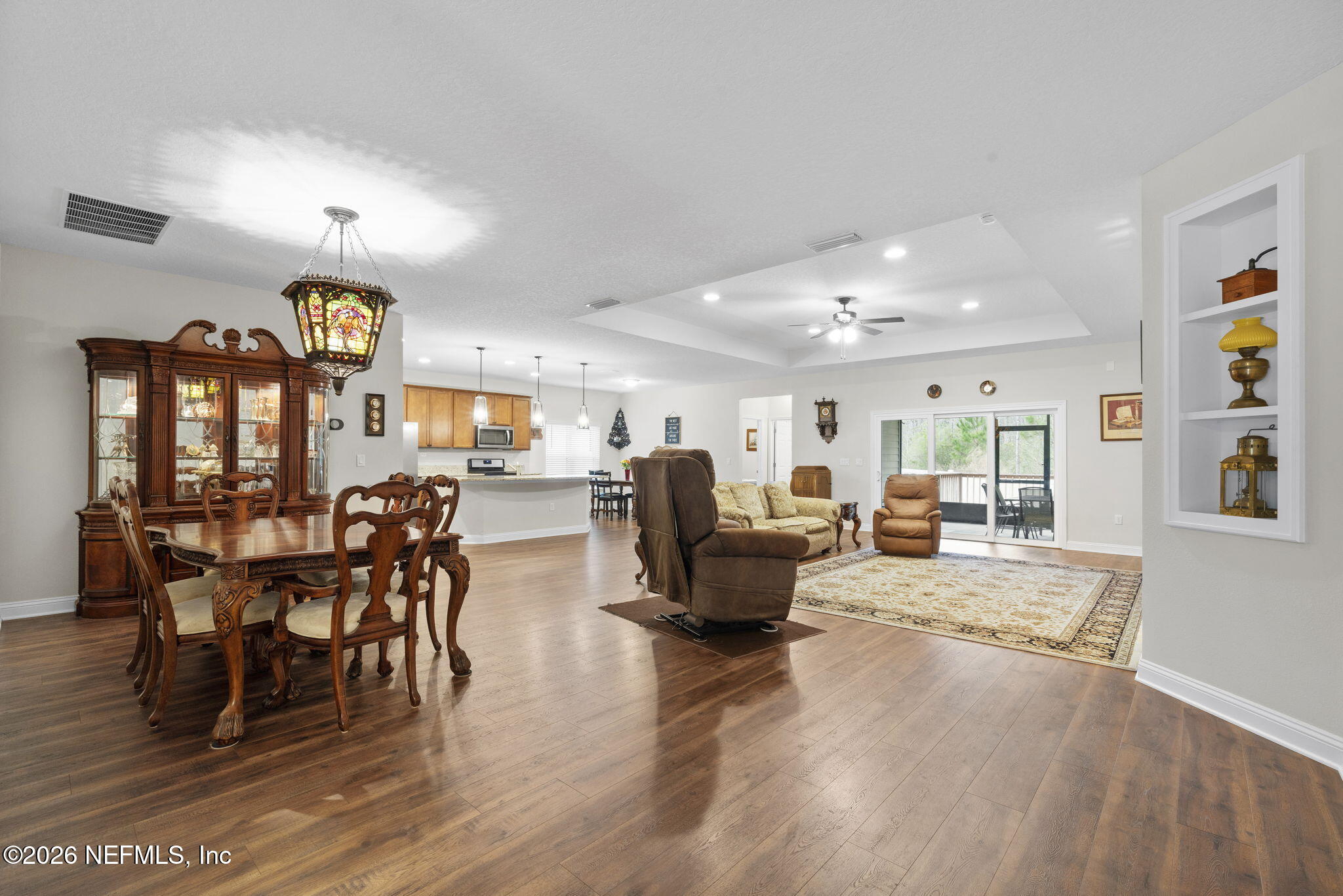 620 Ivory Palm Road Orange Park, FL 32073 - Photo 5 of 53 a view of a dining room with furniture chandelier and wooden floor