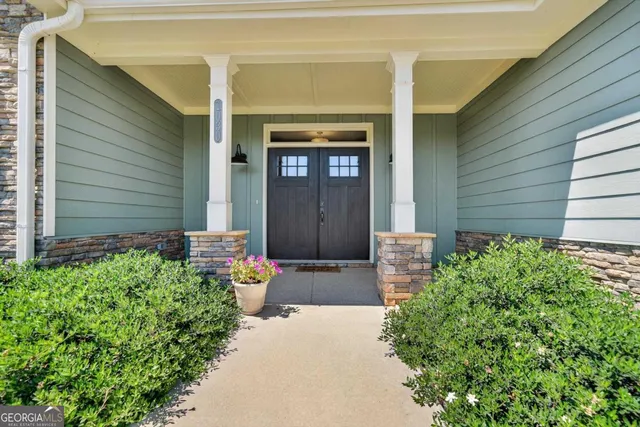 a view of a livingroom with furniture wooden floor and window