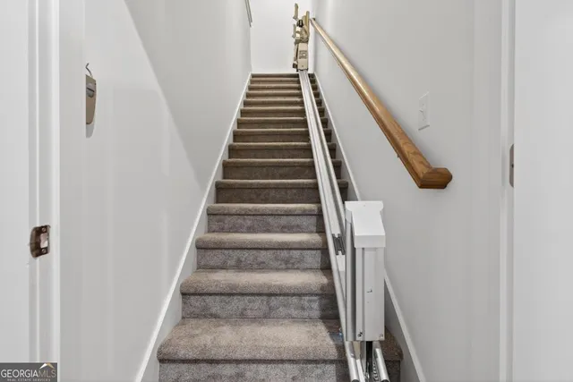 a bed sitting in a room next to a window