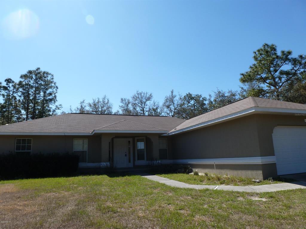 6571 Southwest 151 Loop Ocala, FL 34473 - Photo 1 of 1 a view of house with yard