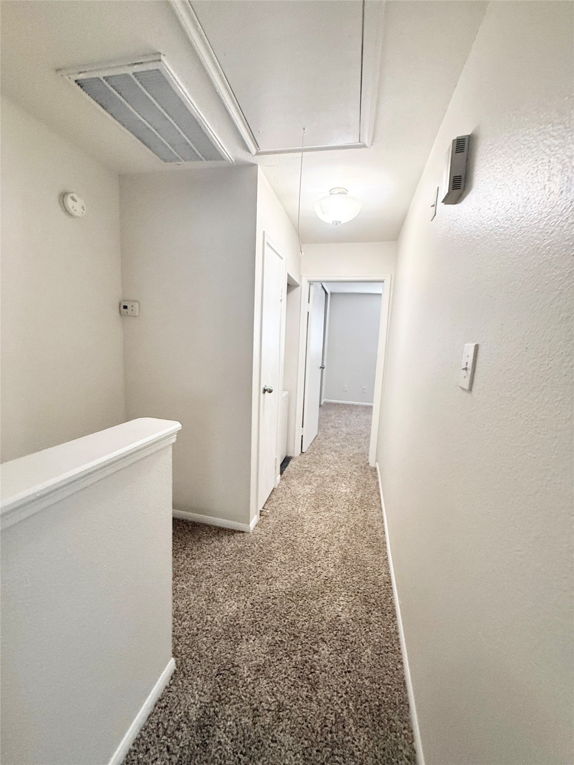 1497 Springrock Lane Houston, TX 77055 - Photo 11 of 23 a view of a hallway with wooden floor
