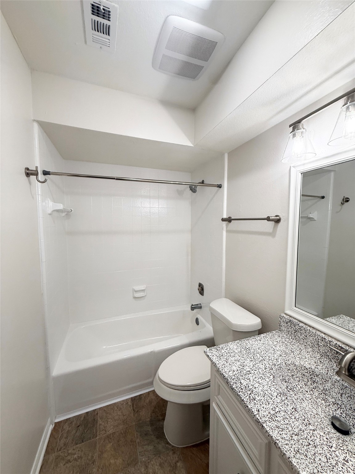 1497 Springrock Lane Houston, TX 77055 - Photo 22 of 23 a bathroom with a granite countertop sink toilet and shower