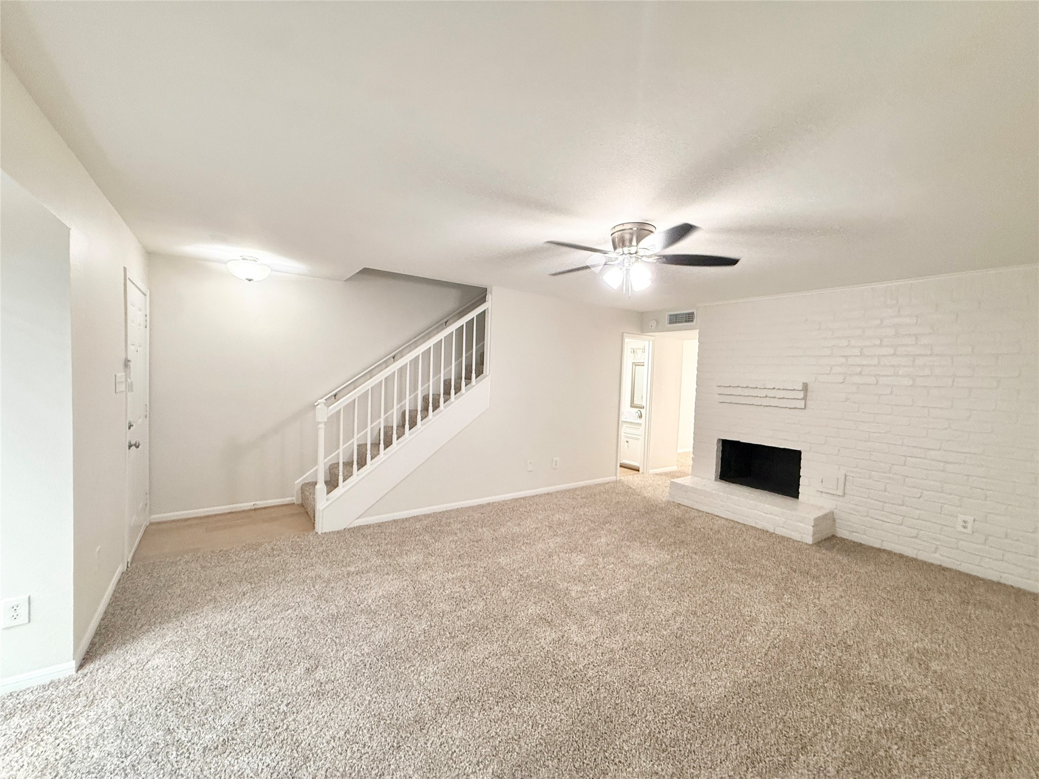 1497 Springrock Lane Houston, TX 77055 - Photo 3 of 23 a view of an empty room with a fireplace