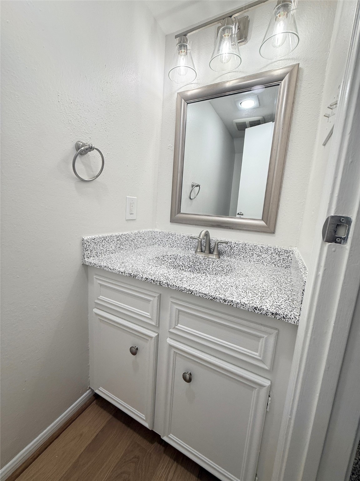 1497 Springrock Lane Houston, TX 77055 - Photo 5 of 23 a bathroom with a granite countertop sink a mirror and vanity