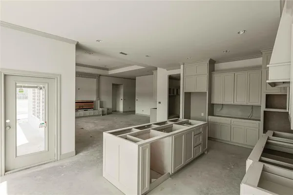 a kitchen that has a stove and a refrigerator