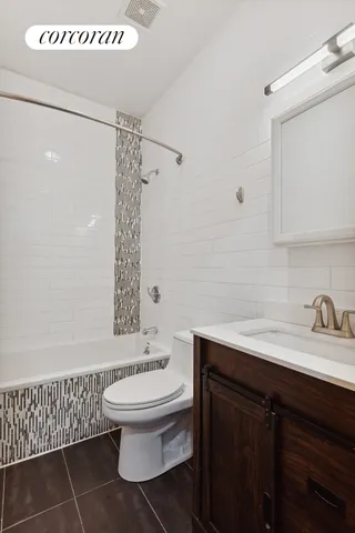 a bathroom with a toilet a sink and a bathtub
