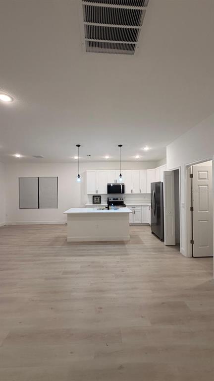 1597 Kerman Street North Port, FL 34288 - Photo 13 of 26 a view of a kitchen with a sink and an oven