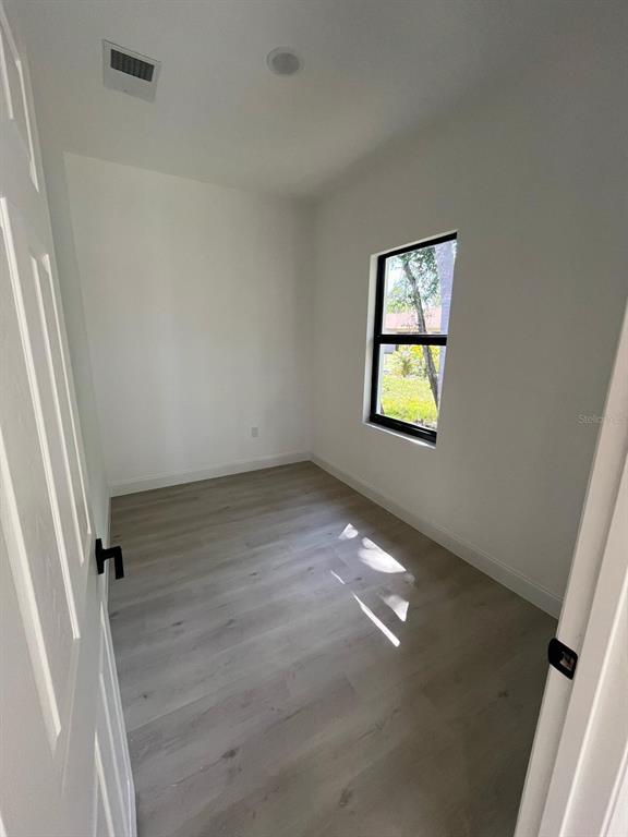 1597 Kerman Street North Port, FL 34288 - Photo 16 of 26 an empty room with windows