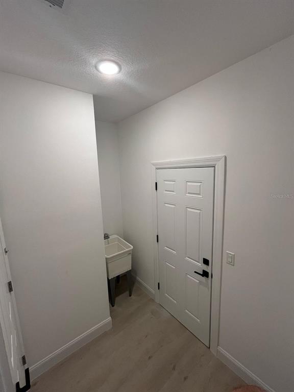 1597 Kerman Street North Port, FL 34288 - Photo 17 of 26 an empty room with a hallway