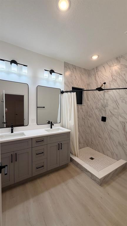 1597 Kerman Street North Port, FL 34288 - Photo 24 of 26 a bathroom with double sink and a shower