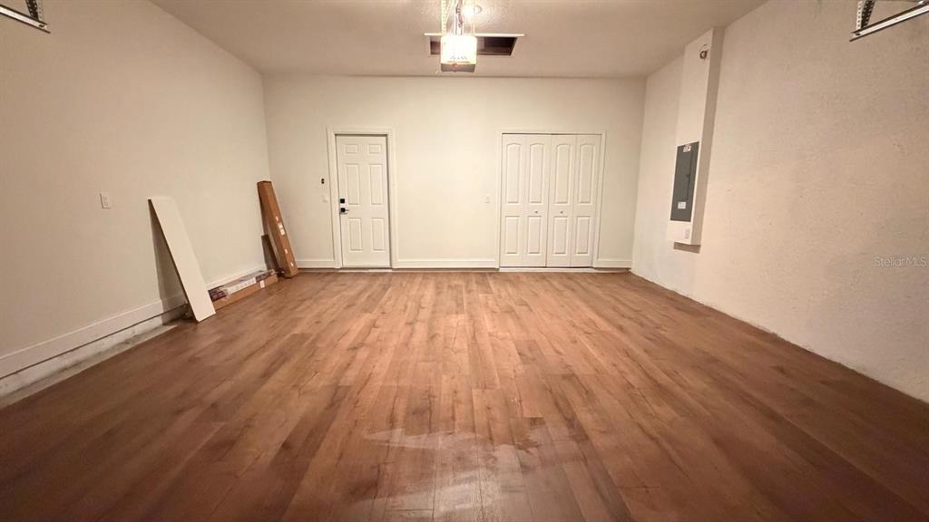 1597 Kerman Street North Port, FL 34288 - Photo 26 of 26 wooden floor in an empty room with a window