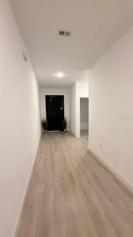 a big room with closet and windows