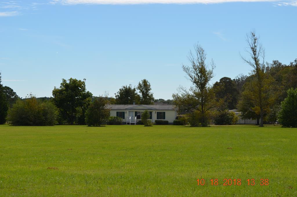 a view of a house with a big yard
