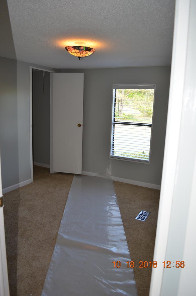 1055 Burnett Road Byron, GA 31008 - Photo 13 of 23 a view of an empty room with a window