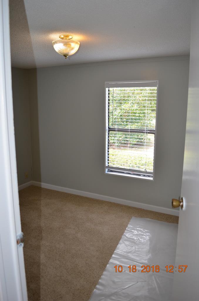 1055 Burnett Road Byron, GA 31008 - Photo 14 of 23 a view of an empty room with a window