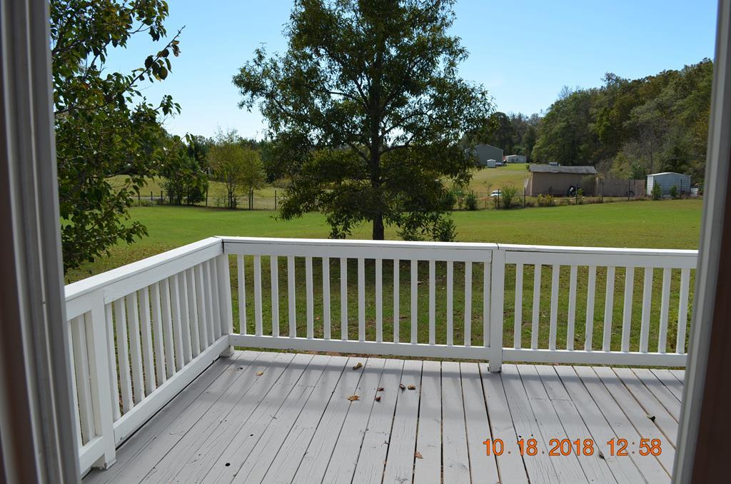 1055 Burnett Road Byron, GA 31008 - Photo 18 of 23 a view of balcony with wooden floor