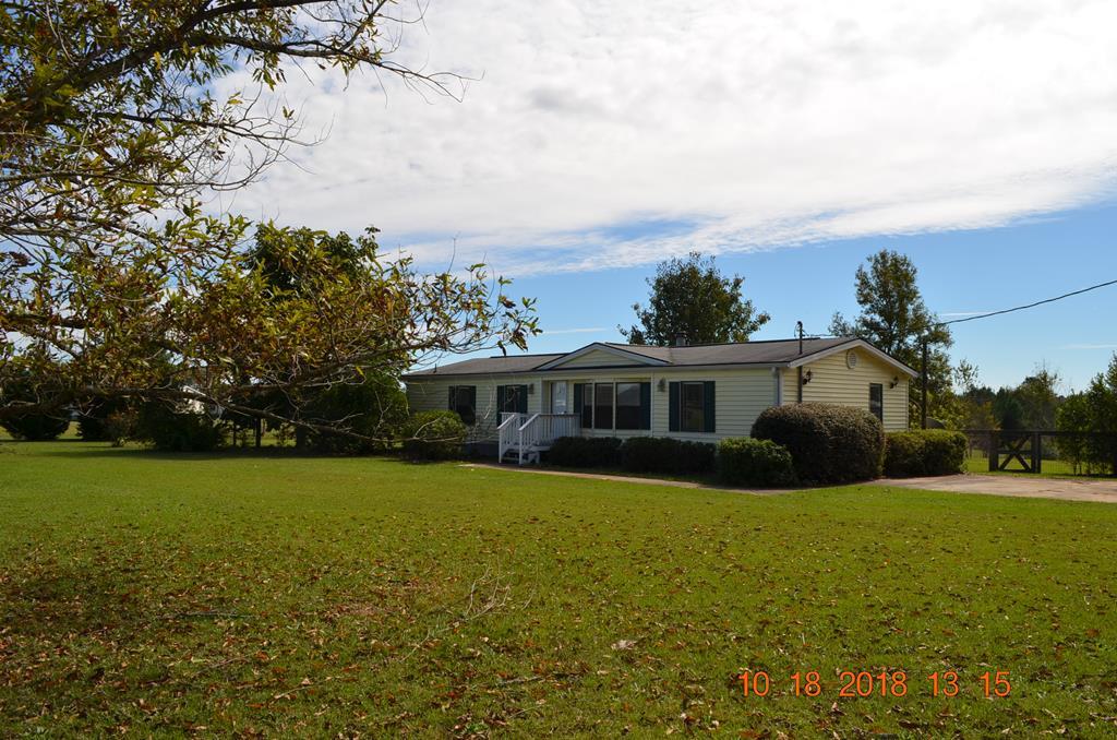 1055 Burnett Road Byron, GA 31008 - Photo 19 of 23 a view of a house with a big yard