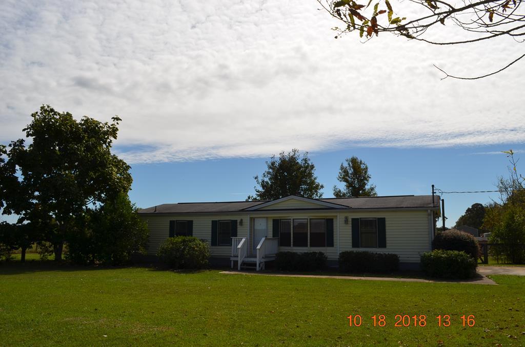 1055 Burnett Road Byron, GA 31008 - Photo 20 of 23 a front view of a house with garden