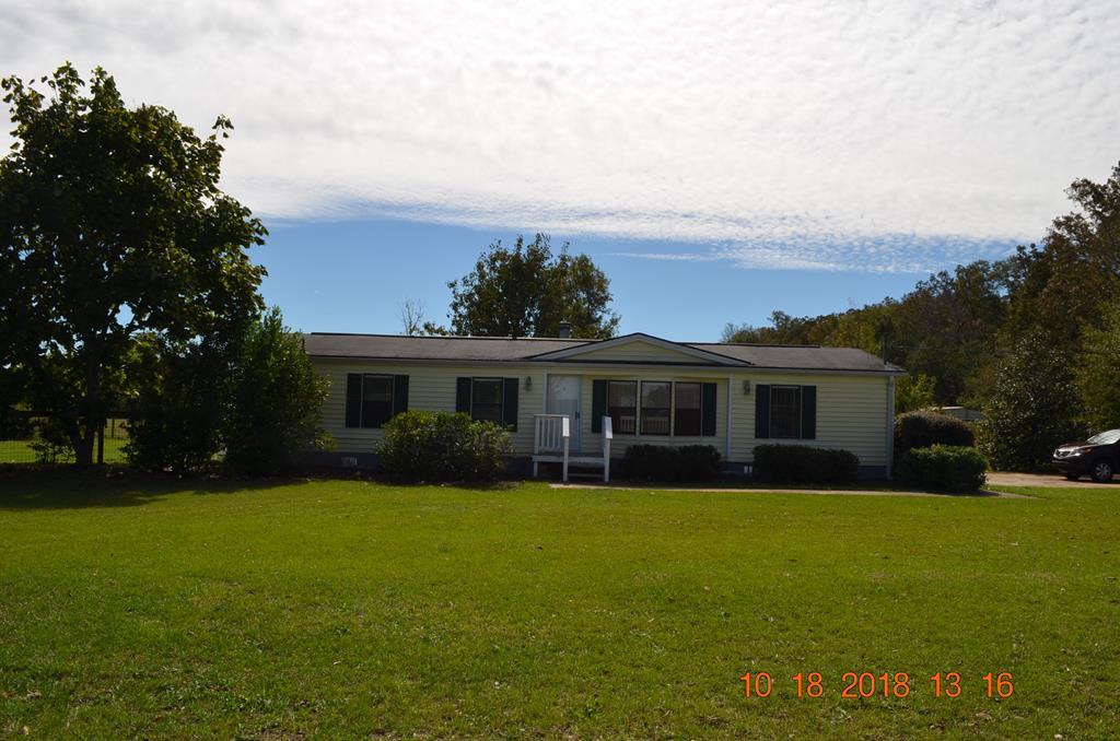 1055 Burnett Road Byron, GA 31008 - Photo 21 of 23 a front view of house with yard and green space