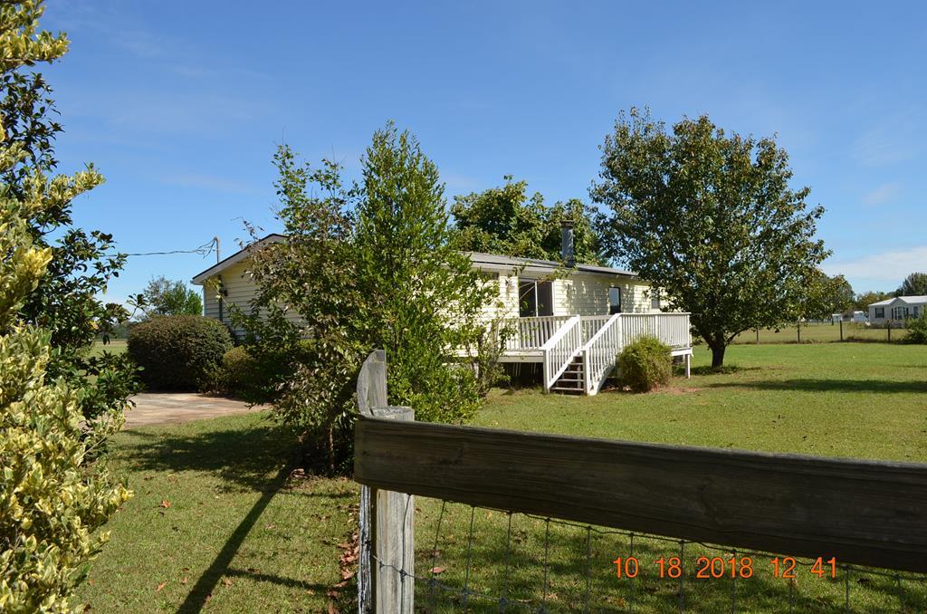 1055 Burnett Road Byron, GA 31008 - Photo 5 of 23 a view of a porch with a yard