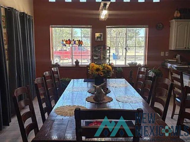 32 Hickey Road Pie Town, NM 87827 - Photo 11 of 39 Dining area with healthy amount of natural light and tile patterned floors