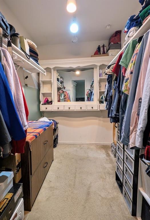 1901 Bosque Lane Arlington, TX 76006 - Photo 11 of 13 a view of walk in closet with clothes and shoes