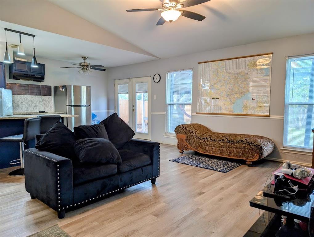 1901 Bosque Lane Arlington, TX 76006 - Photo 5 of 13 a living room with furniture and a large window