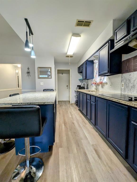 1901 Bosque Lane Arlington, TX 76006 - Photo 8 of 13 a kitchen with stainless steel appliances wooden cabinets a sink and a stove