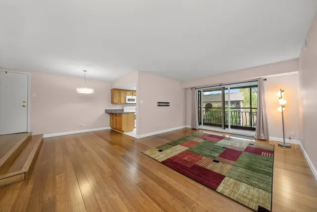 a living room with yard view and a large window