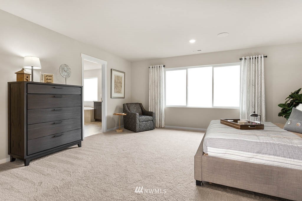 21119 Meridian Drive Southeast, Unit P21 Bothell, WA 98021 - Photo 19 of 31 a bedroom with furniture and window