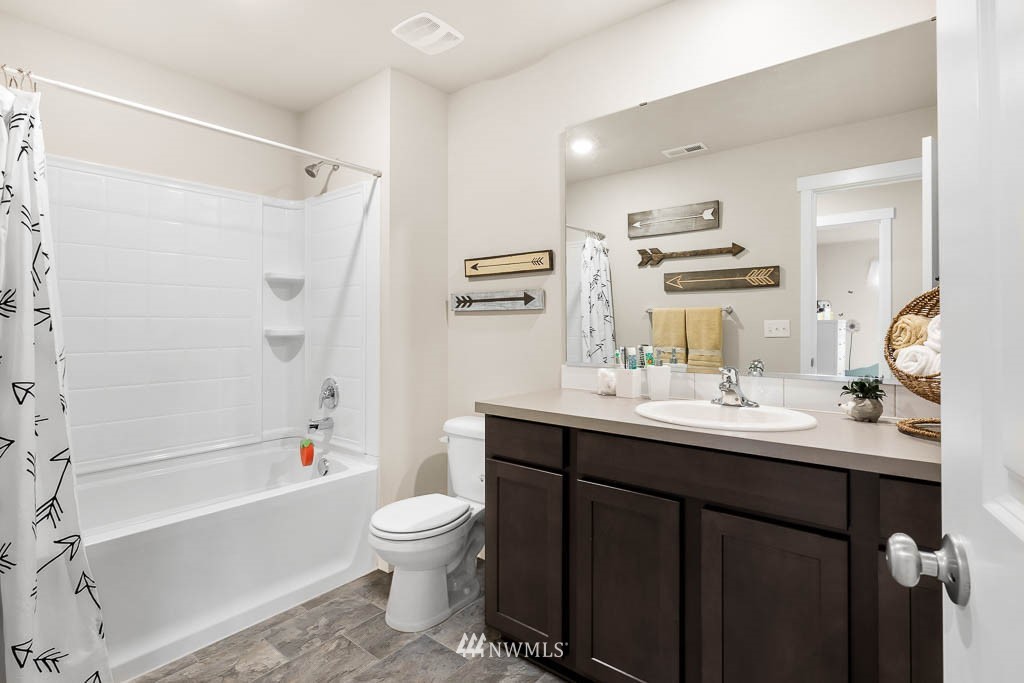 21119 Meridian Drive Southeast, Unit P21 Bothell, WA 98021 - Photo 31 of 31 a bathroom with a sink a toilet and shower