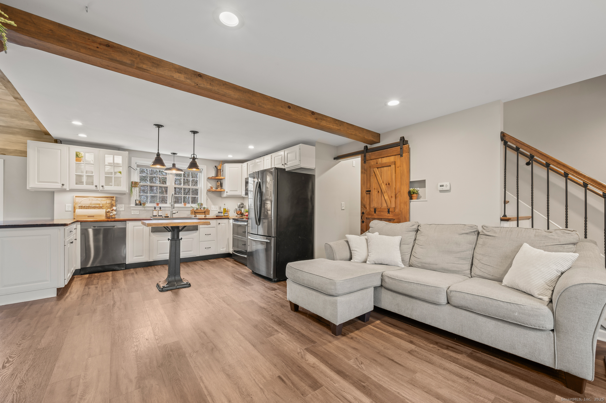 192 Leonard Road Stafford, CT 06076 - Photo 11 of 40 a living room with stainless steel appliances furniture and a kitchen view