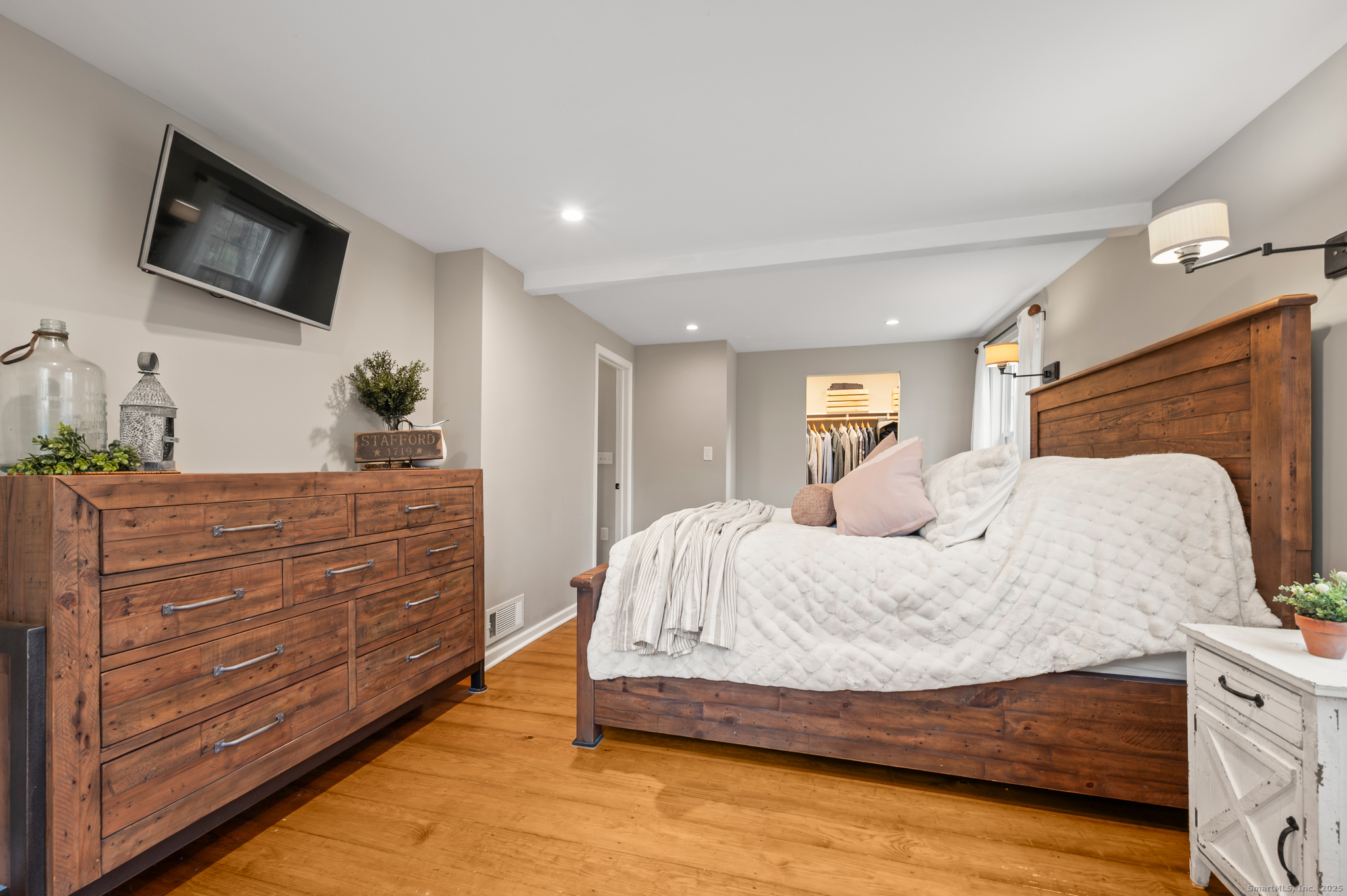192 Leonard Road Stafford, CT 06076 - Photo 14 of 40 a bedroom with a large bed and flat tv screen on dresser