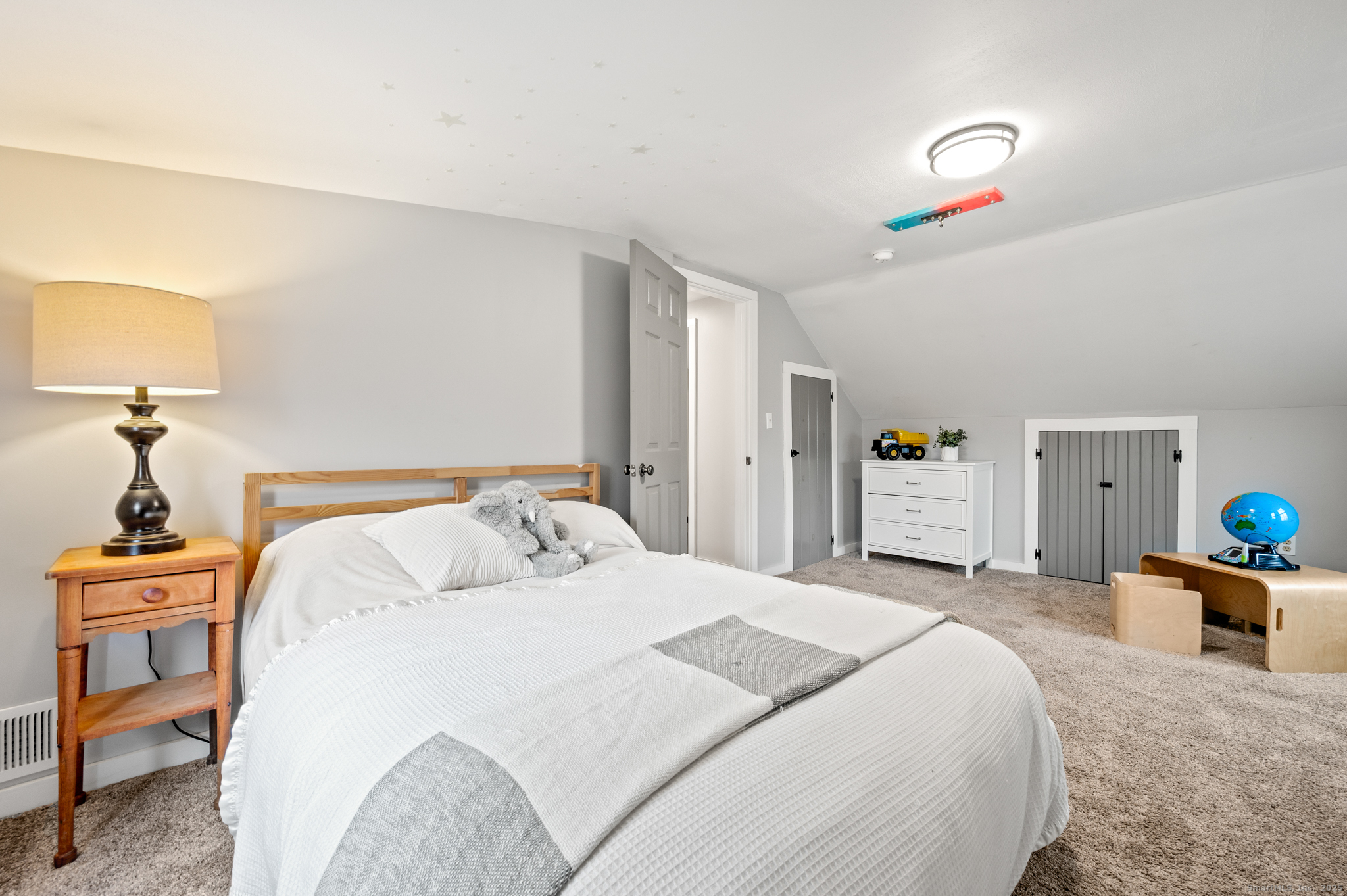 192 Leonard Road Stafford, CT 06076 - Photo 24 of 40 a bedroom with a bed and a chandelier