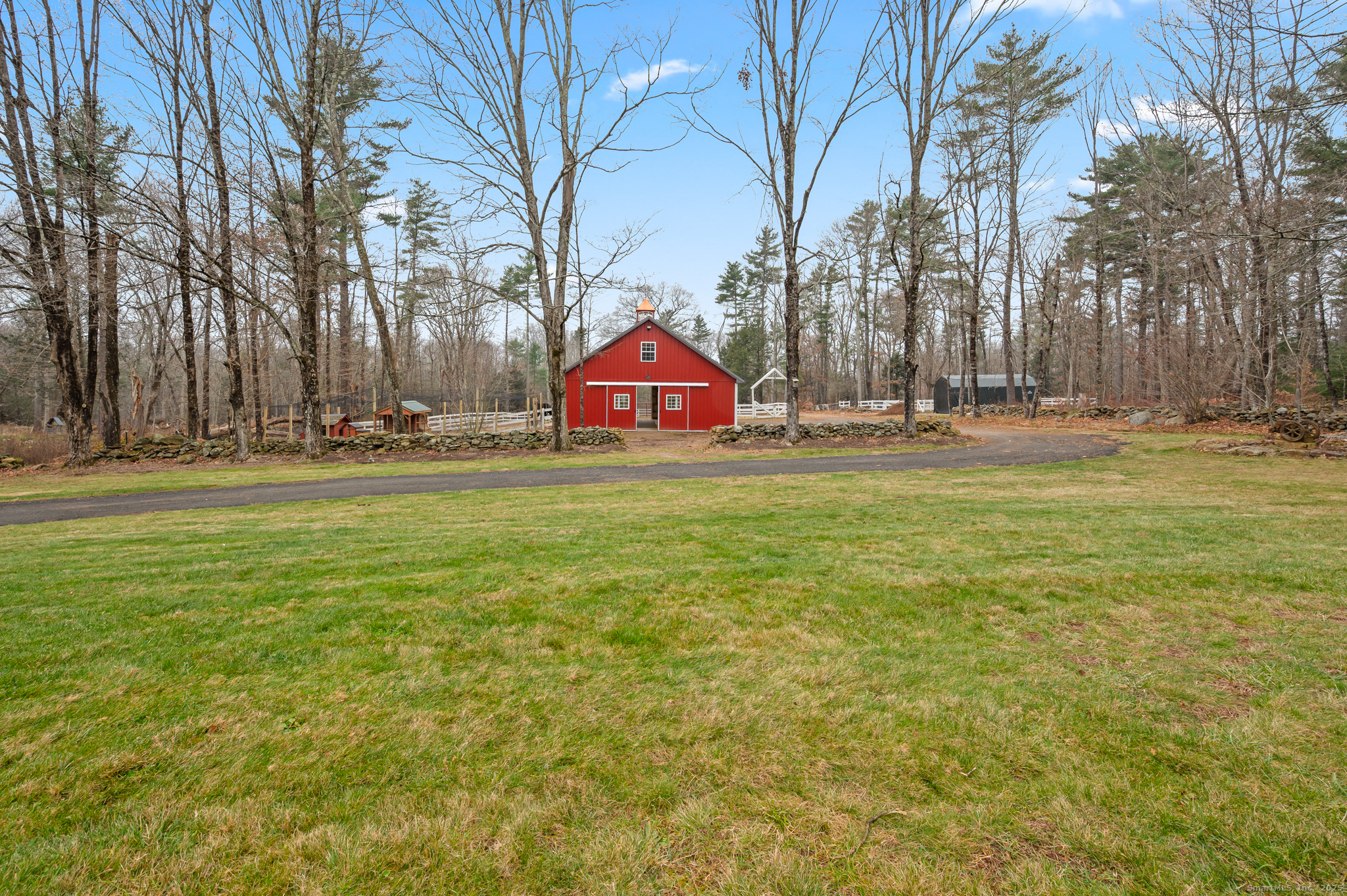 192 Leonard Road Stafford, CT 06076 - Photo 27 of 40 a swimming pool is sitting in the middle of a field