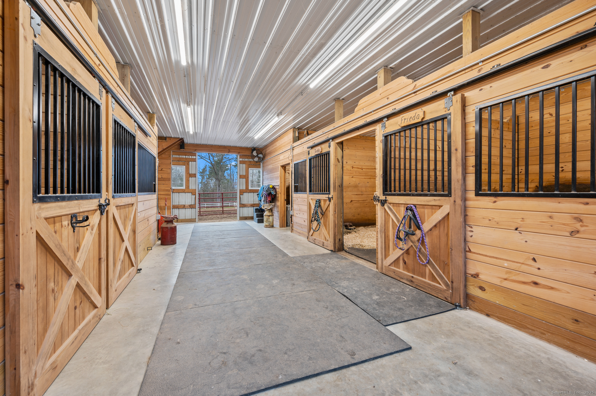 192 Leonard Road Stafford, CT 06076 - Photo 29 of 40 a view of a porch with wooden floor and iron stairs