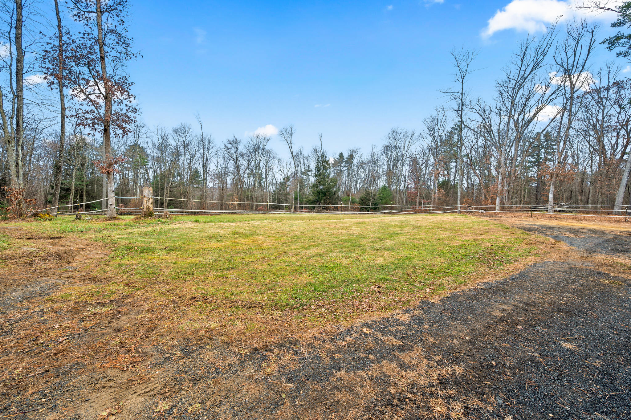 192 Leonard Road Stafford, CT 06076 - Photo 34 of 40 a large body of water with a building in the background