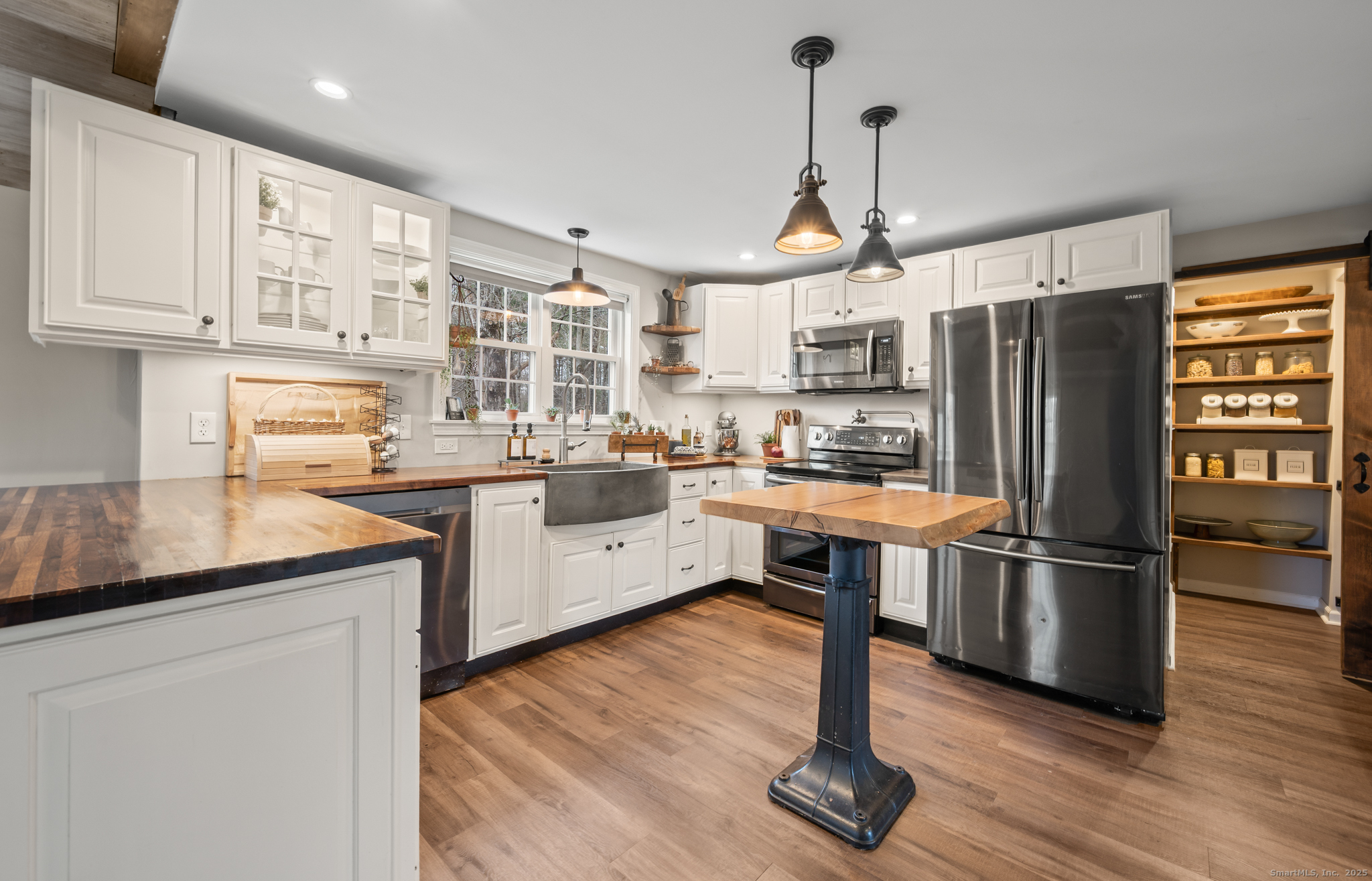 192 Leonard Road Stafford, CT 06076 - Photo 6 of 40 a kitchen with stainless steel appliances granite countertop a refrigerator a stove a sink dishwasher and a oven with wooden floor