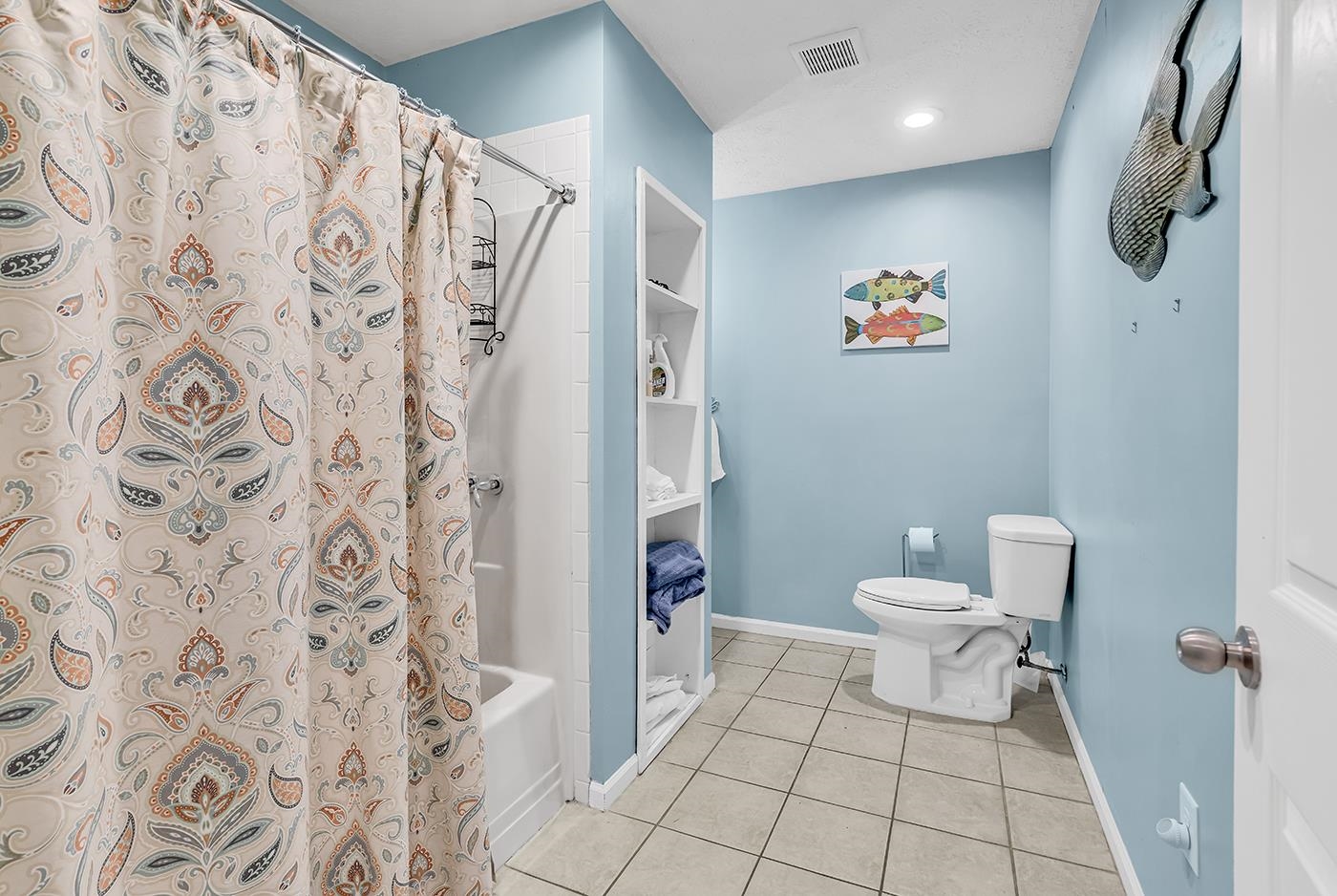 724 Juniper Drive, Unit B Surfside Beach, SC 29575 - Photo 15 of 36 Bathroom featuring shower / bath combination with curtain and light tile patterned flooring
