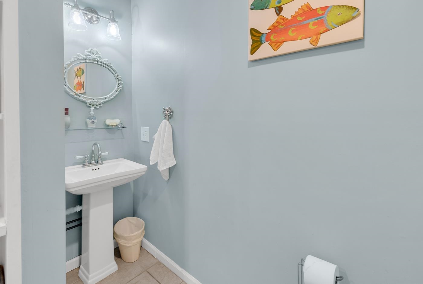 724 Juniper Drive, Unit B Surfside Beach, SC 29575 - Photo 16 of 36 Half bathroom featuring baseboards and tile patterned flooring