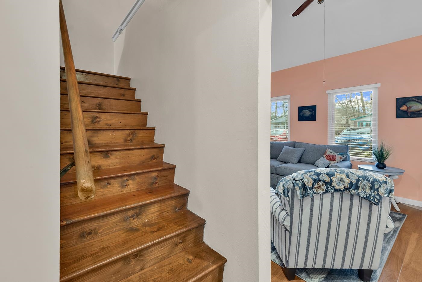 724 Juniper Drive, Unit B Surfside Beach, SC 29575 - Photo 17 of 36 Stairs featuring a ceiling fan and wood finished floors