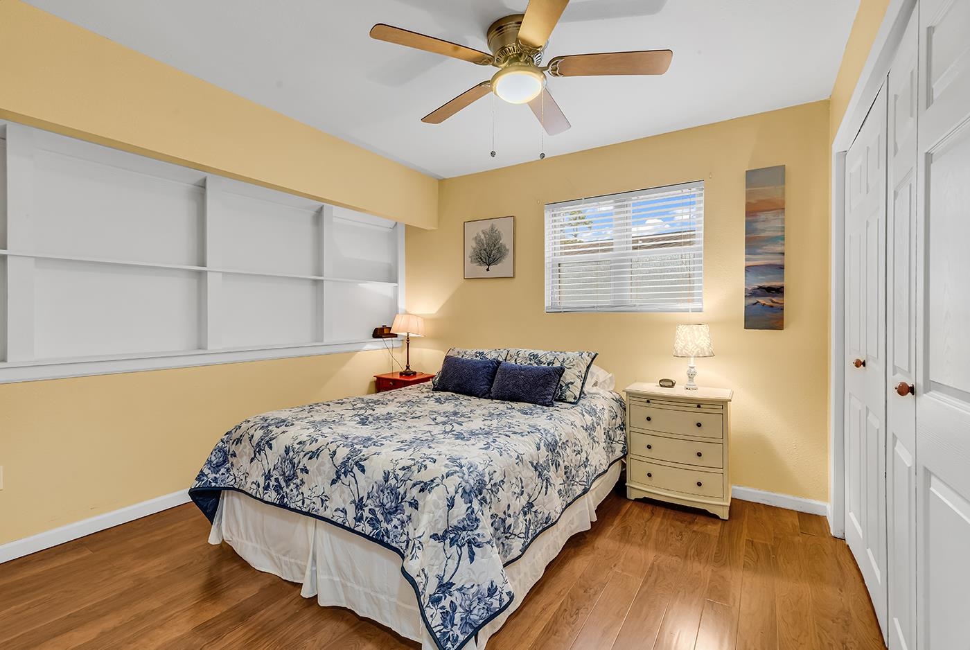 724 Juniper Drive, Unit B Surfside Beach, SC 29575 - Photo 18 of 36 Bedroom with a closet, wood finished floors, and a ceiling fan