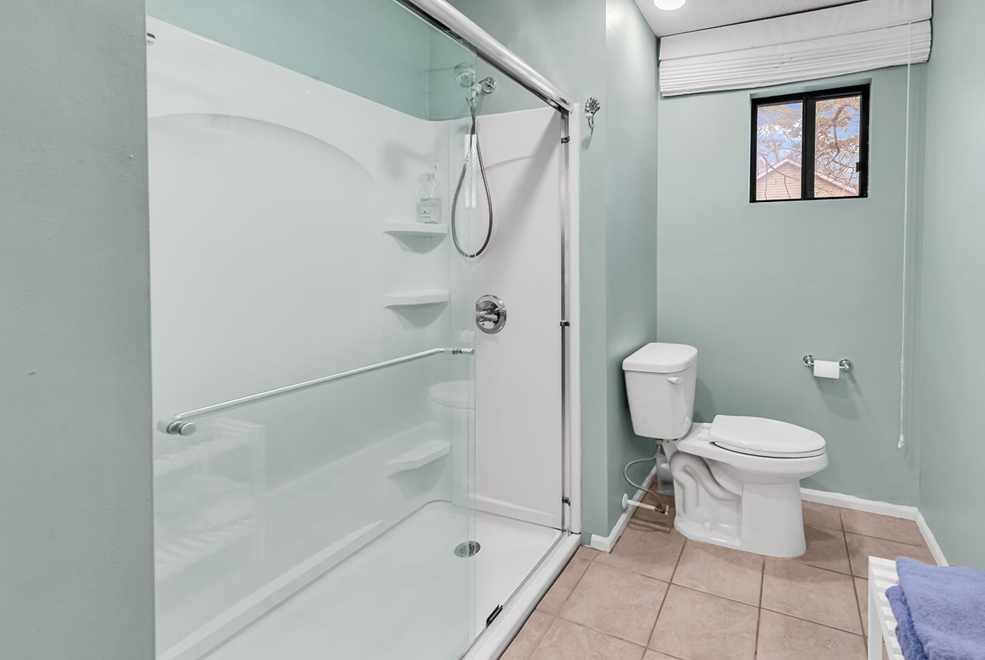 724 Juniper Drive, Unit B Surfside Beach, SC 29575 - Photo 21 of 36 Bathroom with a shower stall and light tile patterned floors