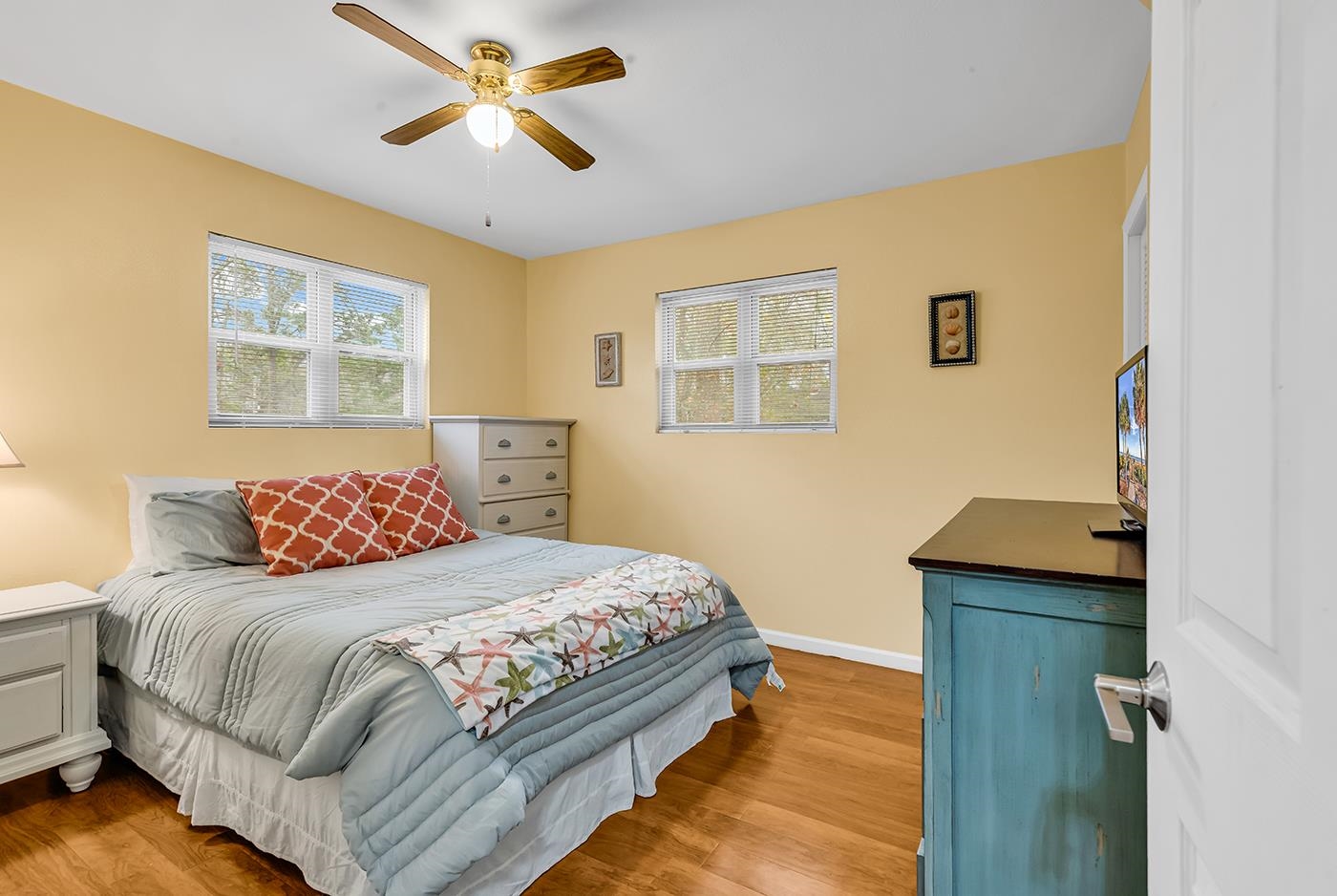 724 Juniper Drive, Unit B Surfside Beach, SC 29575 - Photo 23 of 36 Bedroom featuring a ceiling fan and light wood finished floors