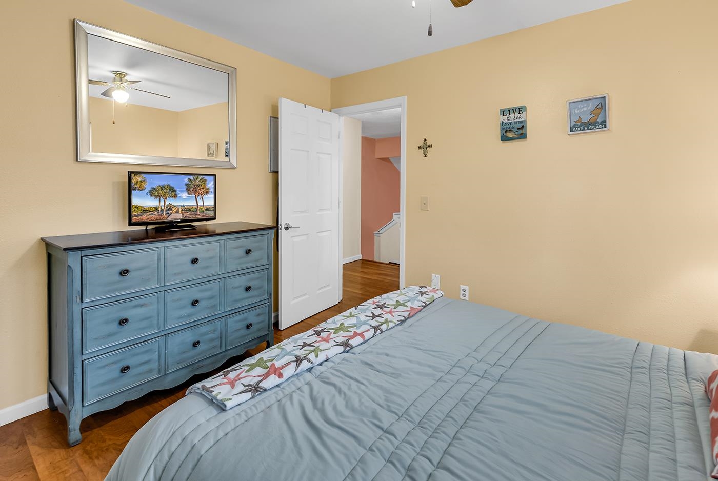 724 Juniper Drive, Unit B Surfside Beach, SC 29575 - Photo 24 of 36 Bedroom with dark wood finished floors and ceiling fan