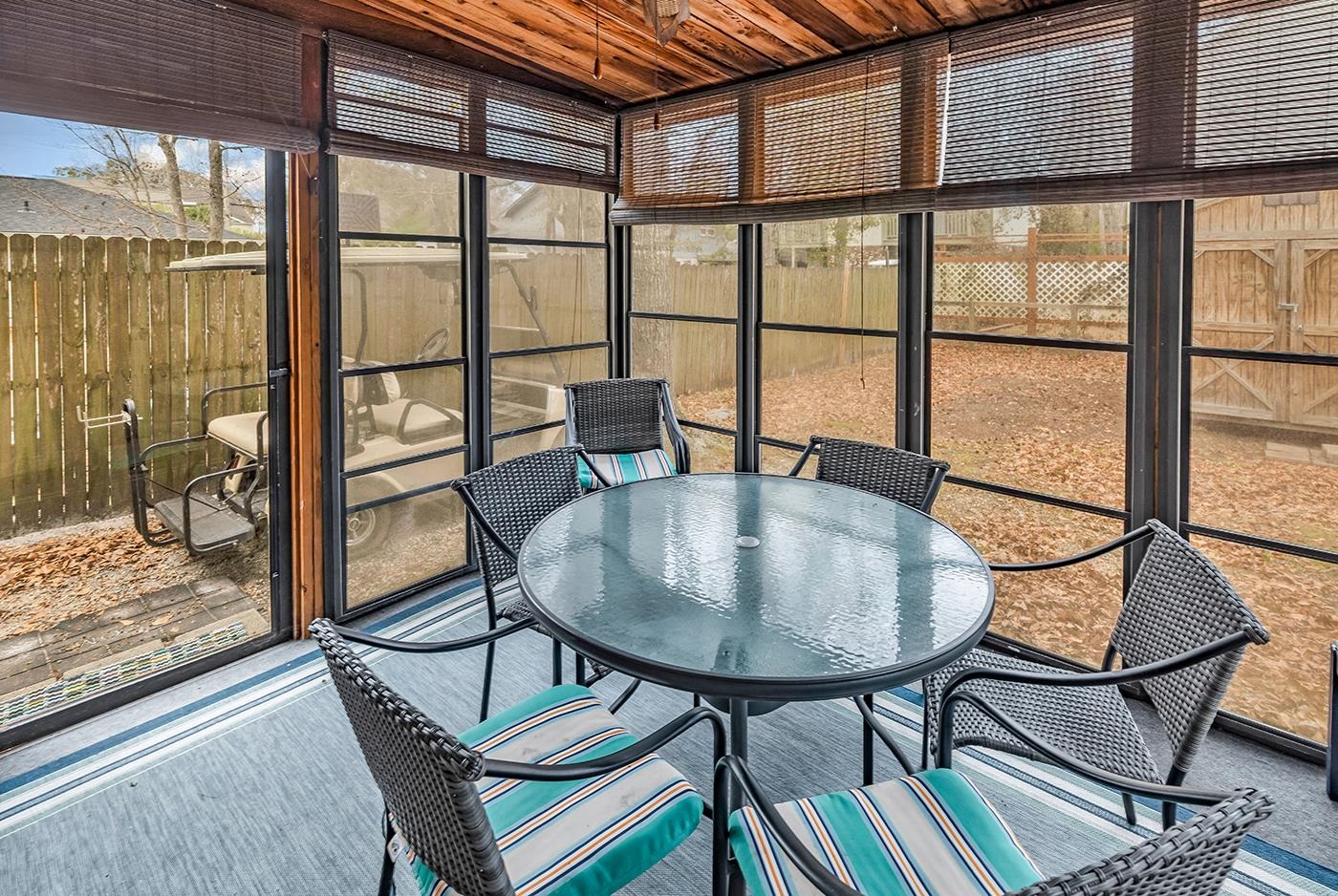 724 Juniper Drive, Unit B Surfside Beach, SC 29575 - Photo 26 of 36 Sunroom with outdoor dining space