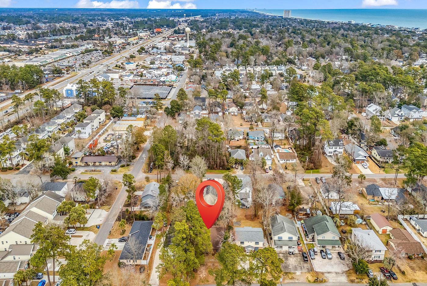 724 Juniper Drive, Unit B Surfside Beach, SC 29575 - Photo 32 of 36 Aerial view of property and surrounding area featuring nearby suburban area